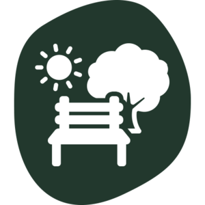 Symbol einer Parkbank vor einem Baum mit Sonne und steht für Erholung.